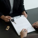The car dealer provides advice on loans, insurance details, and car rental information, and delivers